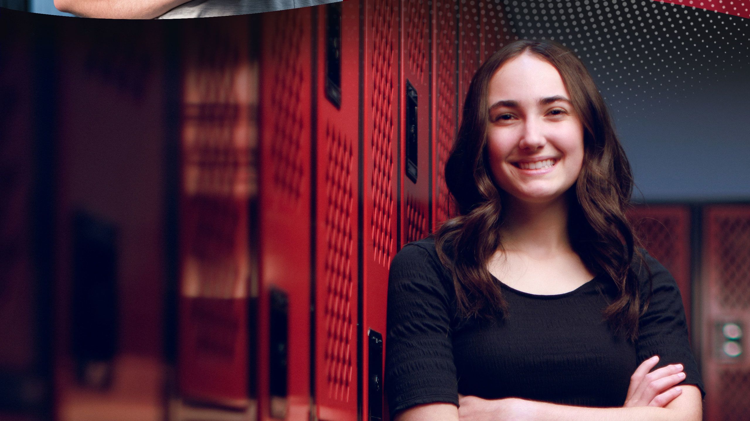 Brittany Grigorian posing by a set of lockers.